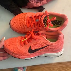 Nike Orange Athletic Shoes with Breathable Mesh and Sleek Design